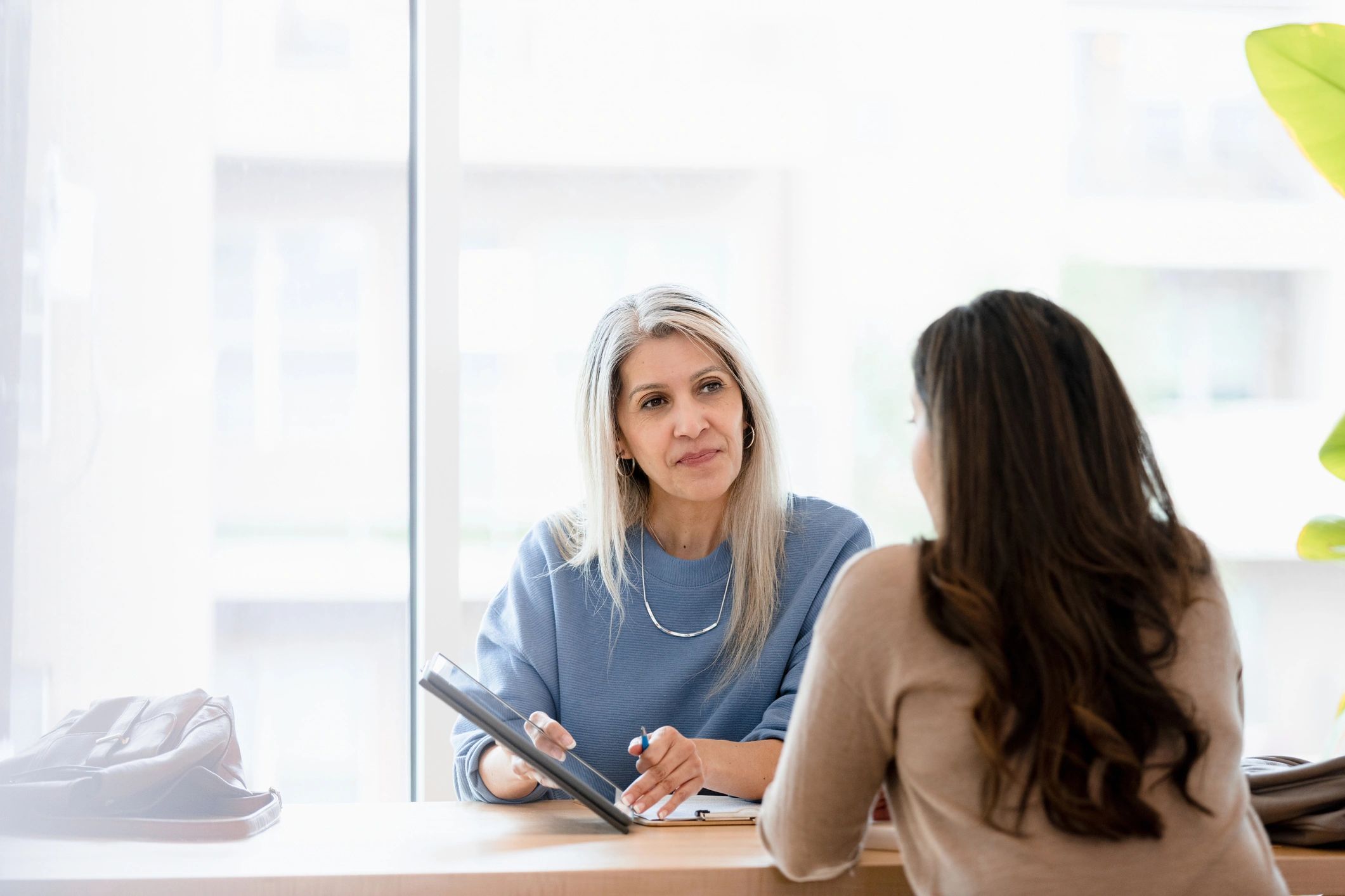 Attorney meeting with a client in a professional office